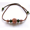 Handmade lampwork recycled glass beads on a simulated leather thong